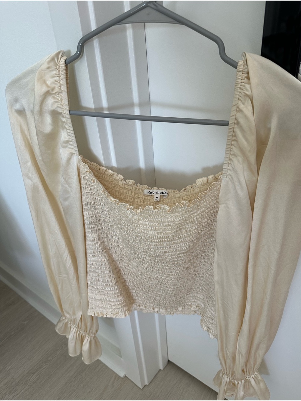 Reformation 100% silk cream blouse with ruffled sleeves, size M